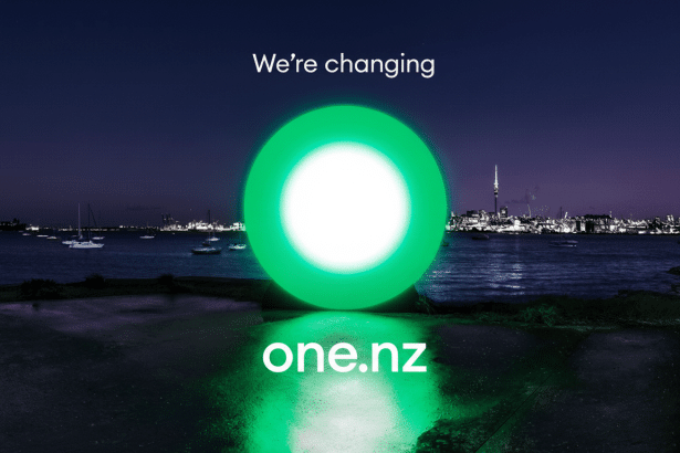 The We're changing one.nz logo is displayed against a nighttime harbor background with boats and a city skyline.