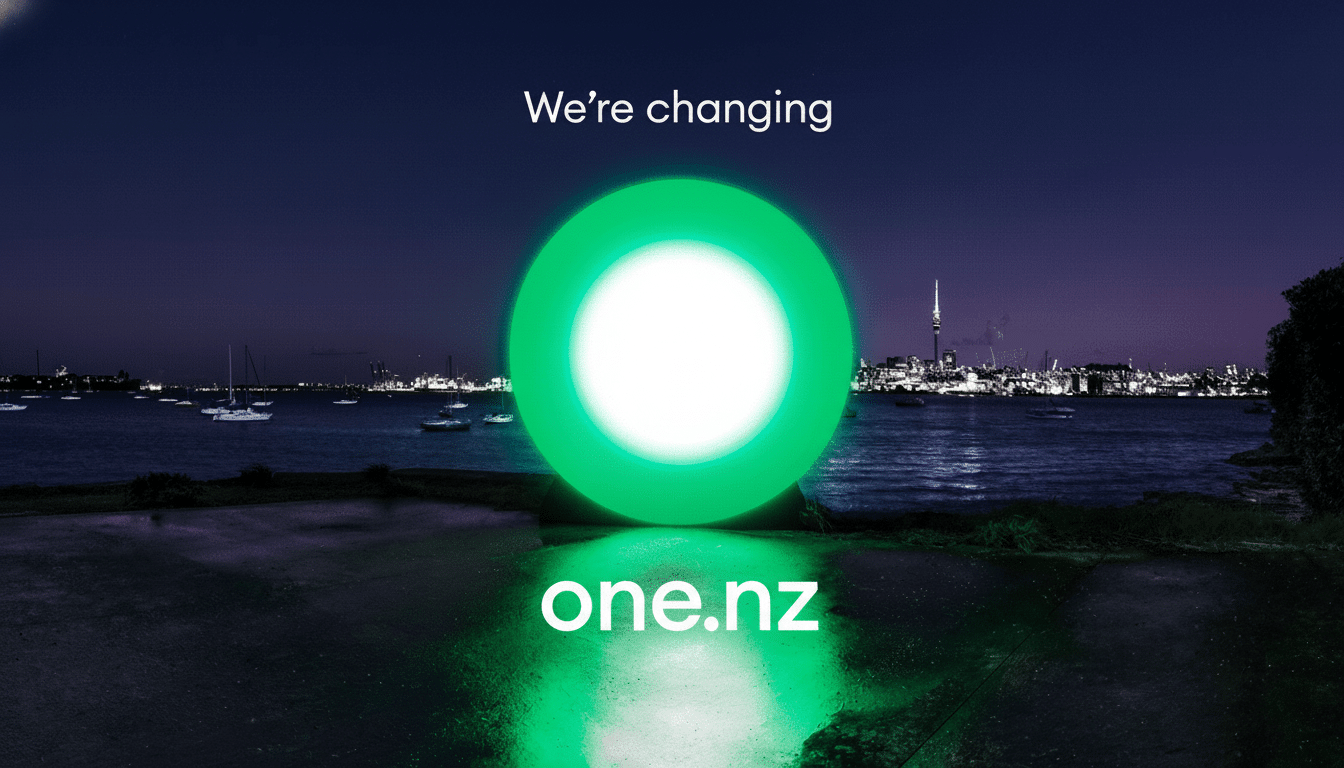 The We're changing one.nz logo is displayed against a nighttime harbor background with boats and a city skyline.