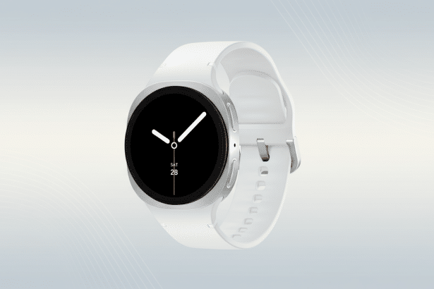 A white smartwatch with a silver casing and a black screen displaying the time and date ( SAT 28), set against a subtle gray and white gradient background. Filename : whitesmart watchprofessional display .png