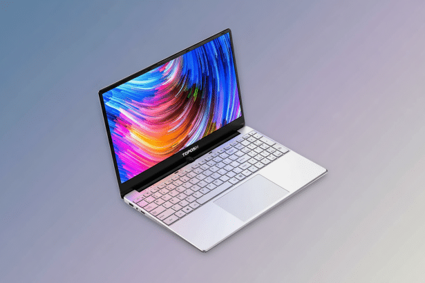 A professional , enhanced image of a silver laptop with a colorful abstract background on its screen, set against a soft, professional gradient background. Filename : silver laptopprofessional 1 6x9. png