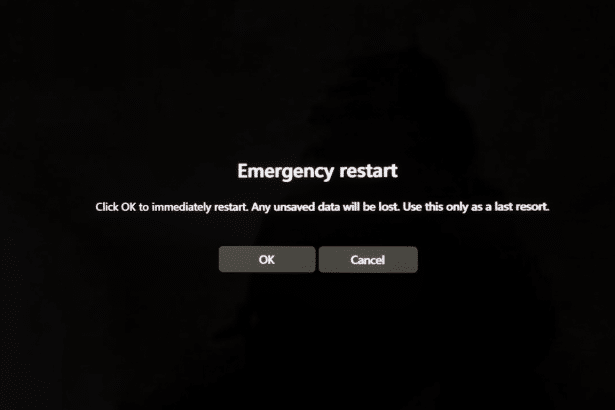 Emergency restart dialog box on a dark screen with OK and Cancel buttons.