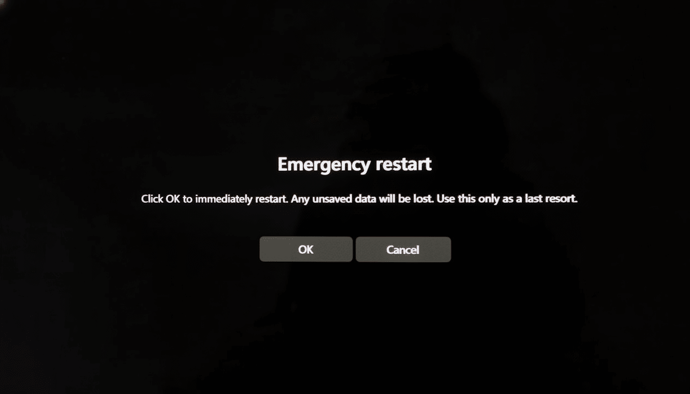 Emergency restart dialog box on a dark screen with OK and Cancel buttons.