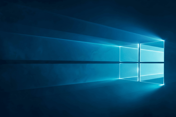 The Windows logo rendered in light blue against a dark blue background , with light rays emanating from the logo, resized to a 1 6:9 aspect ratio. Filename : windowslogo blue 1 6x 9.png