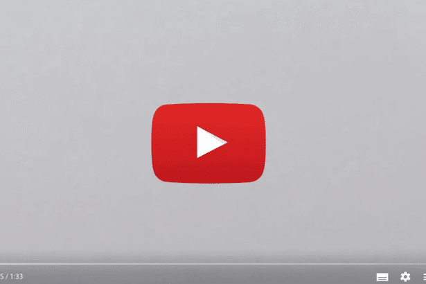 A screenshot of a YouTube video player showing the red play button logo centered on a light gray background, with playback controls visible at the bottom.