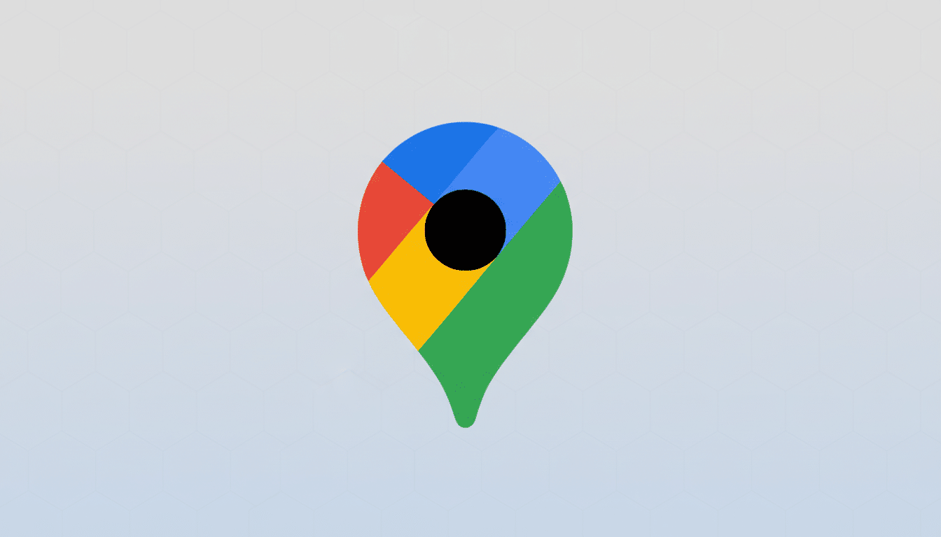 A 16:9 aspect ratio image of the Google Maps pin icon, featuring a blue, red, yellow, and green design with a black circle in the center, set against a professional light gray background with a subtle hexagonal pattern.