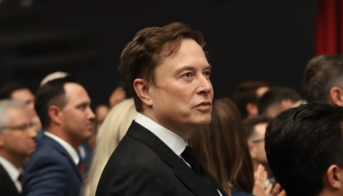 A professional headshot of Elon Musk in a suit, looking to the right, with a blurred background of people in a formal setting.
