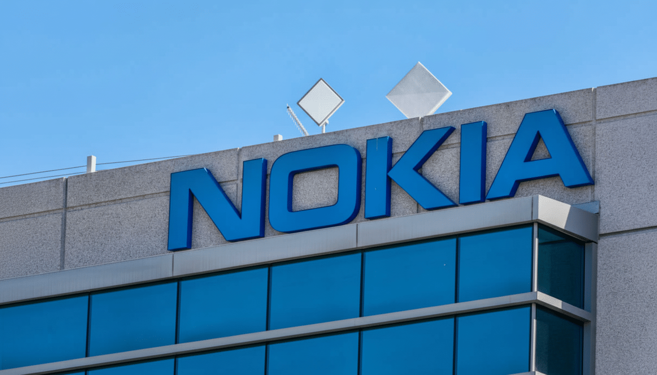 The Nokia logo in blue on a building, resized to a 16:9 aspect ratio with a clear blue sky background.