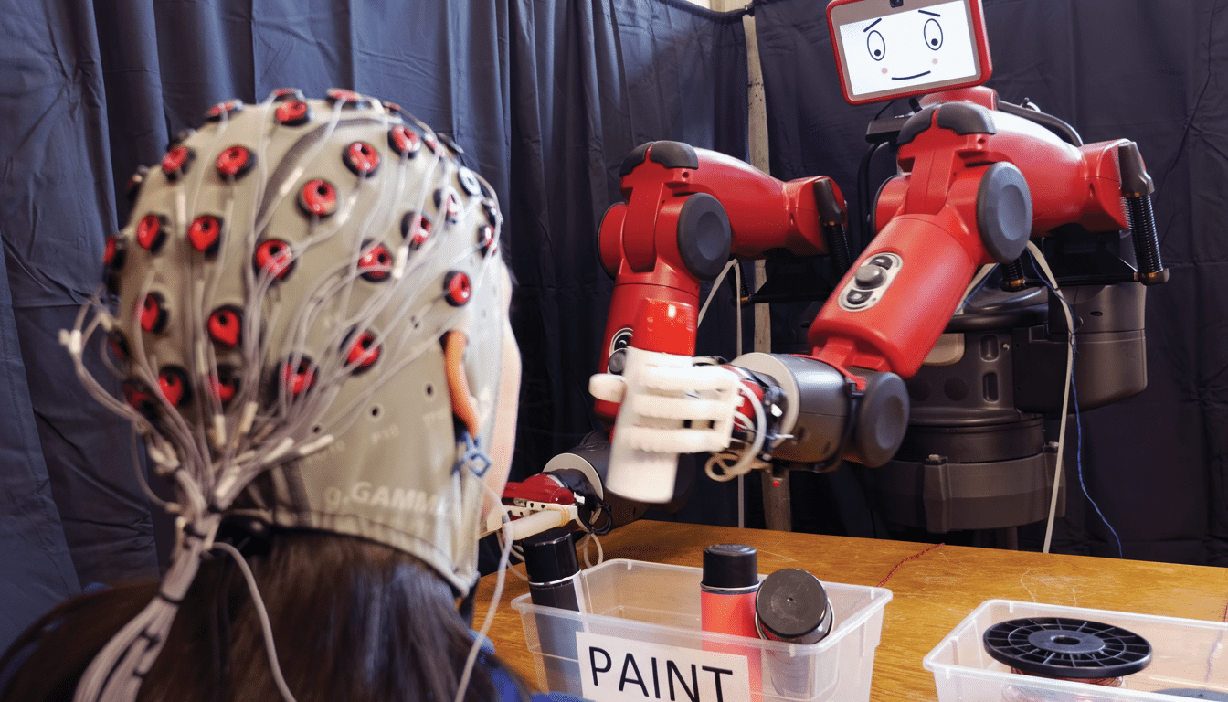 A person wearing an EEG cap interacts with a red robot with a screen for a face, which is holding a white object.