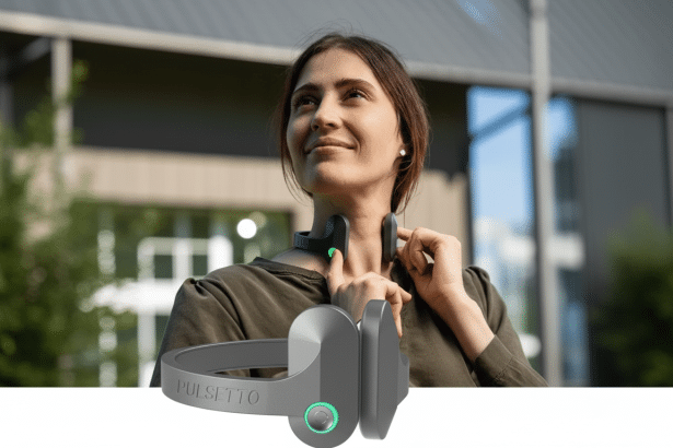 A woman wearing a Pulsetto device around her neck, looking up and smiling, with a larger Pulsetto device in the foreground. The background is a blurred outdoor setting with buildings and trees.