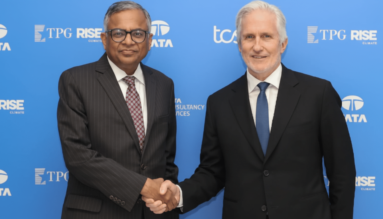 Two men in suits shaking hands in front of a blue background with company logos.