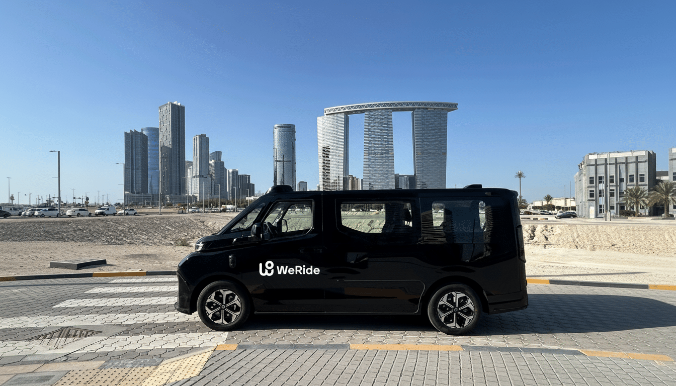 A black WeRide autonomous vehicle parked on a paved area with a city skyline in the background under a clear blue sky.