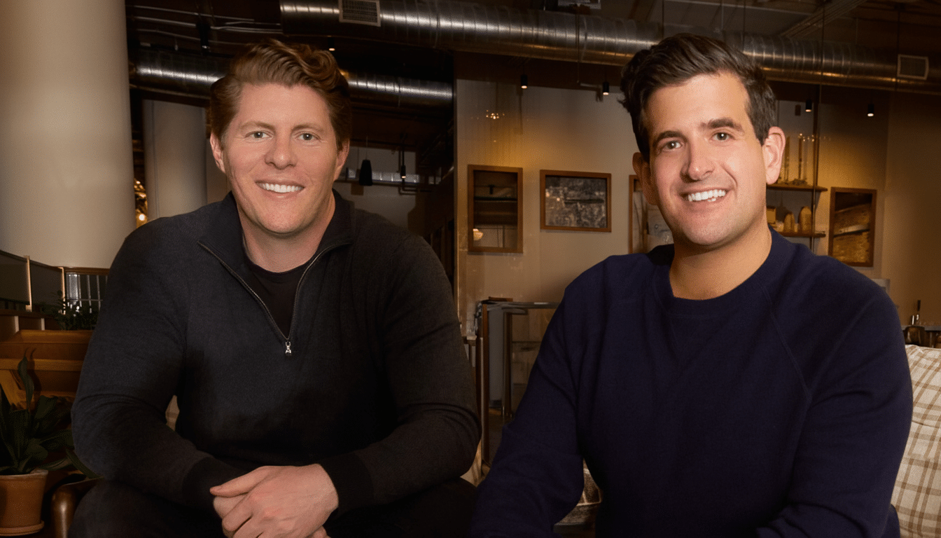 Two men smiling at the camera, resized to a 16:9 aspect ratio.