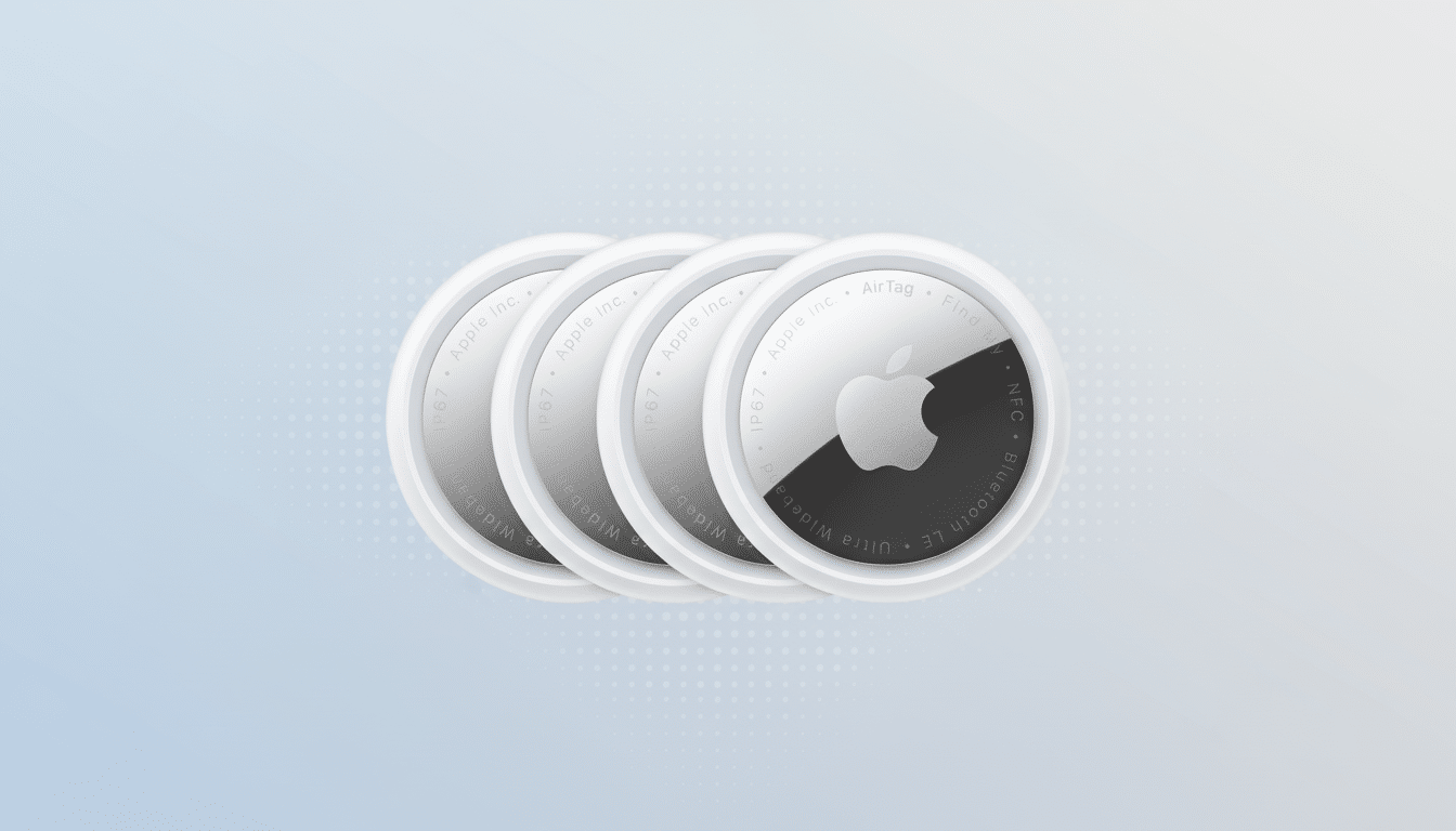 Four Apple AirTags are arranged in a slightly overlapping row against a professional light blue and white gradient background with a subtle dotted pattern.