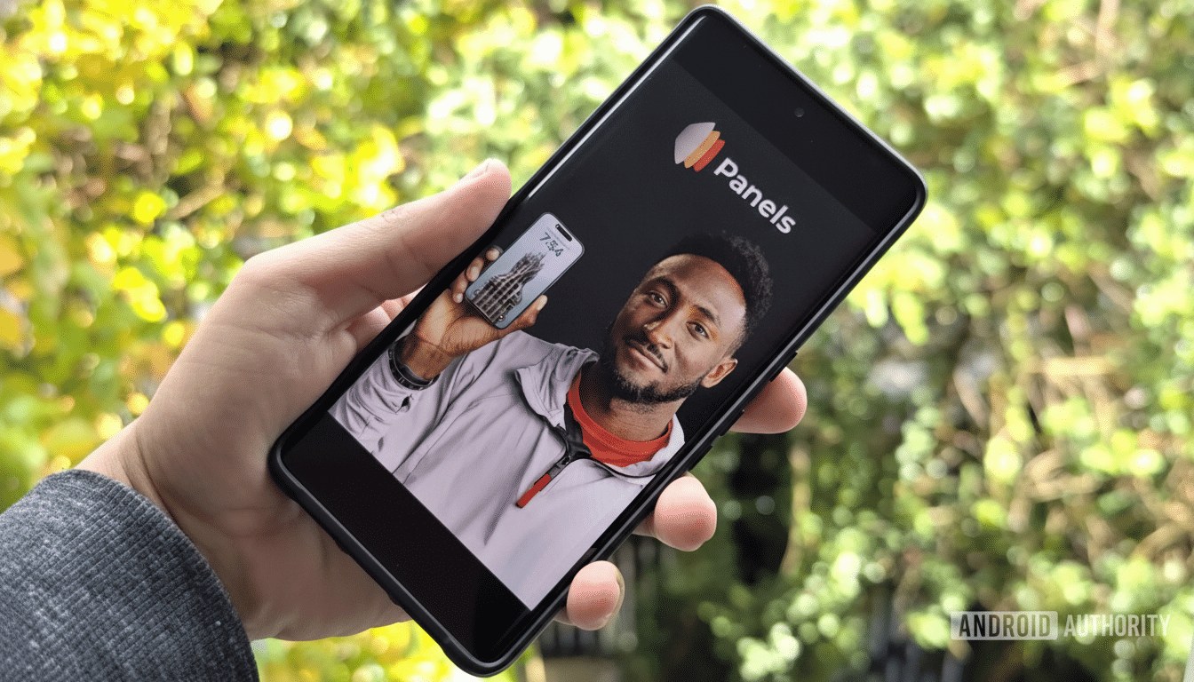 A hand holding a smartphone displaying the Panels app, with a man holding another phone on its screen.