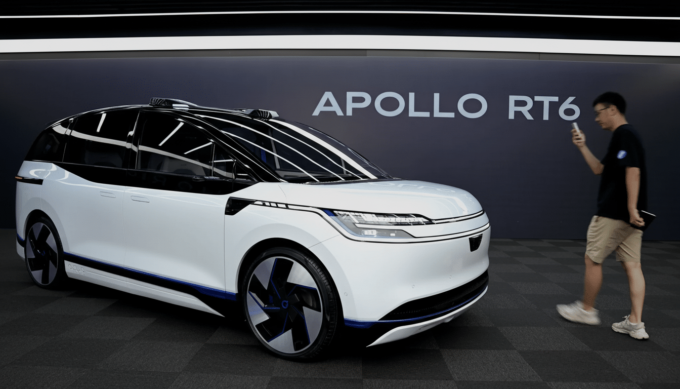 A white Apollo RT6 autonomous vehicle is displayed in a showroom with a man taking a photo of it.