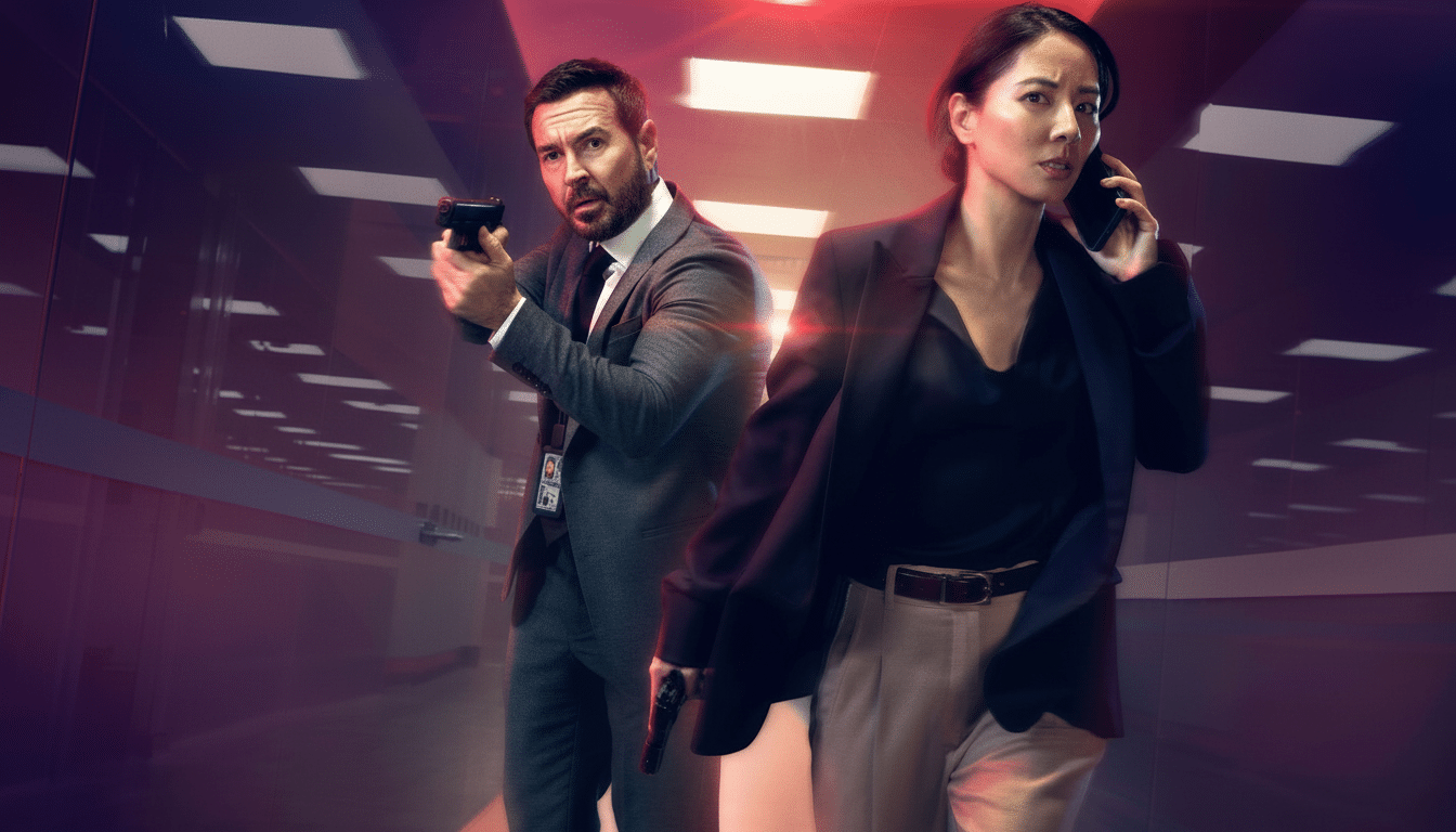 Two individuals, a man and a woman, in a tense, action-oriented pose within a modern, dimly lit corridor. The man, on the left, is Caucasian, bearded, and wearing a suit, holding a pistol with both hands, aiming forward. The woman, on the right, is East Asian, wearing a dark blazer over a light top and trousers, holding a pistol in her right hand and a phone to her ear with her left. Both have serious expressions, and the background features blurred lights and architectural details, suggesting an indoor setting with an urgent atmosphere.