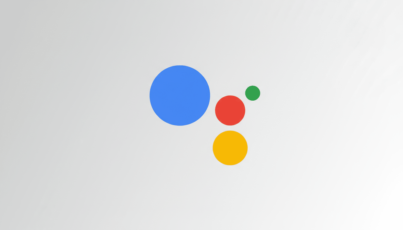 The Google Assistant logo, featuring a large blue circle, a medium red circle, a medium yellow circle, and a small green circle, arranged on a light gray gradient background.