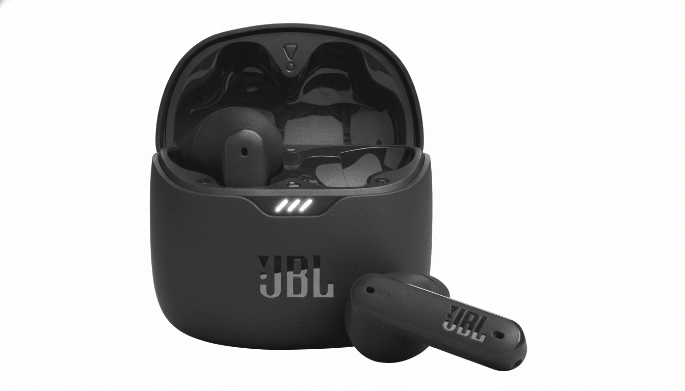 A pair of black JBL wireless earbuds, one in its open charging case and the other resting beside it, presented on a clean white background.