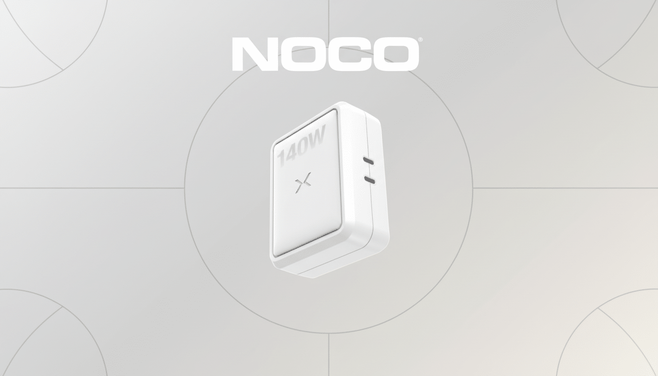 A white NOCO 140W charger with a subtle X logo on the front, presented on a professional light gray background with soft geometric patterns, resized to a 16:9 aspect ratio.