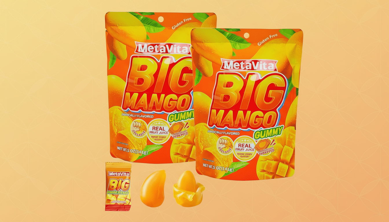 Two large bags of MetaVita Big Mango Gummy candy, a smaller individual packet, and two mango-shaped gummies are displayed against a soft orange gradient background.