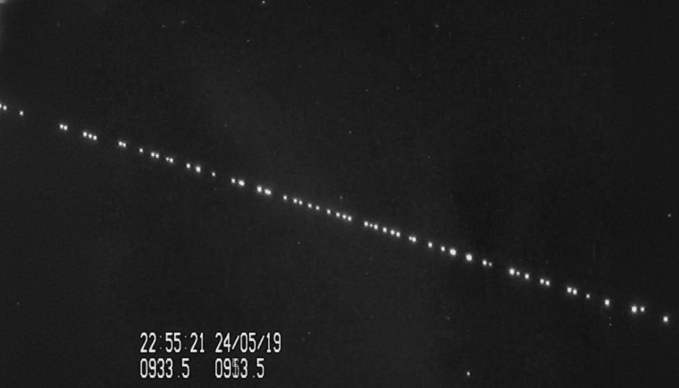 A black and white image showing a diagonal line of bright, evenly spaced dots across a dark sky, with a timestamp 22:55:21 24/05/19 0933.5 0953.5 in the bottom left corner.