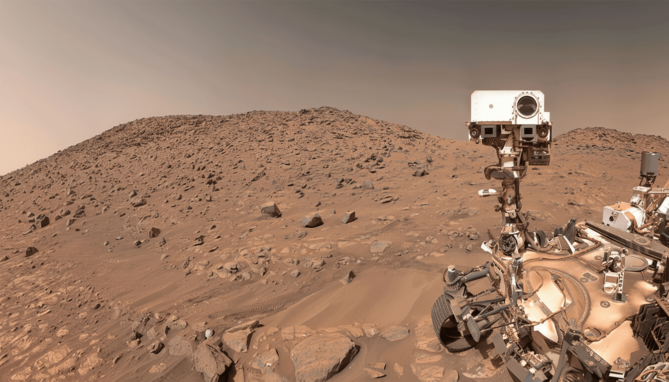 A panoramic view of the Mars landscape with the Curiosity rover in the foreground, resized to a 16:9 aspect ratio.