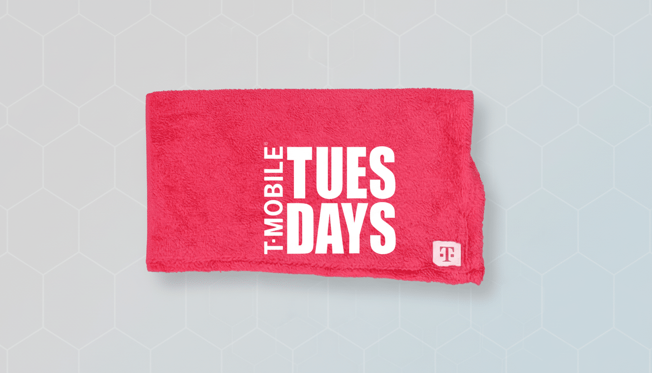 A pink T-Mobile Tuesdays towel on a light gray background with a subtle geometric pattern.