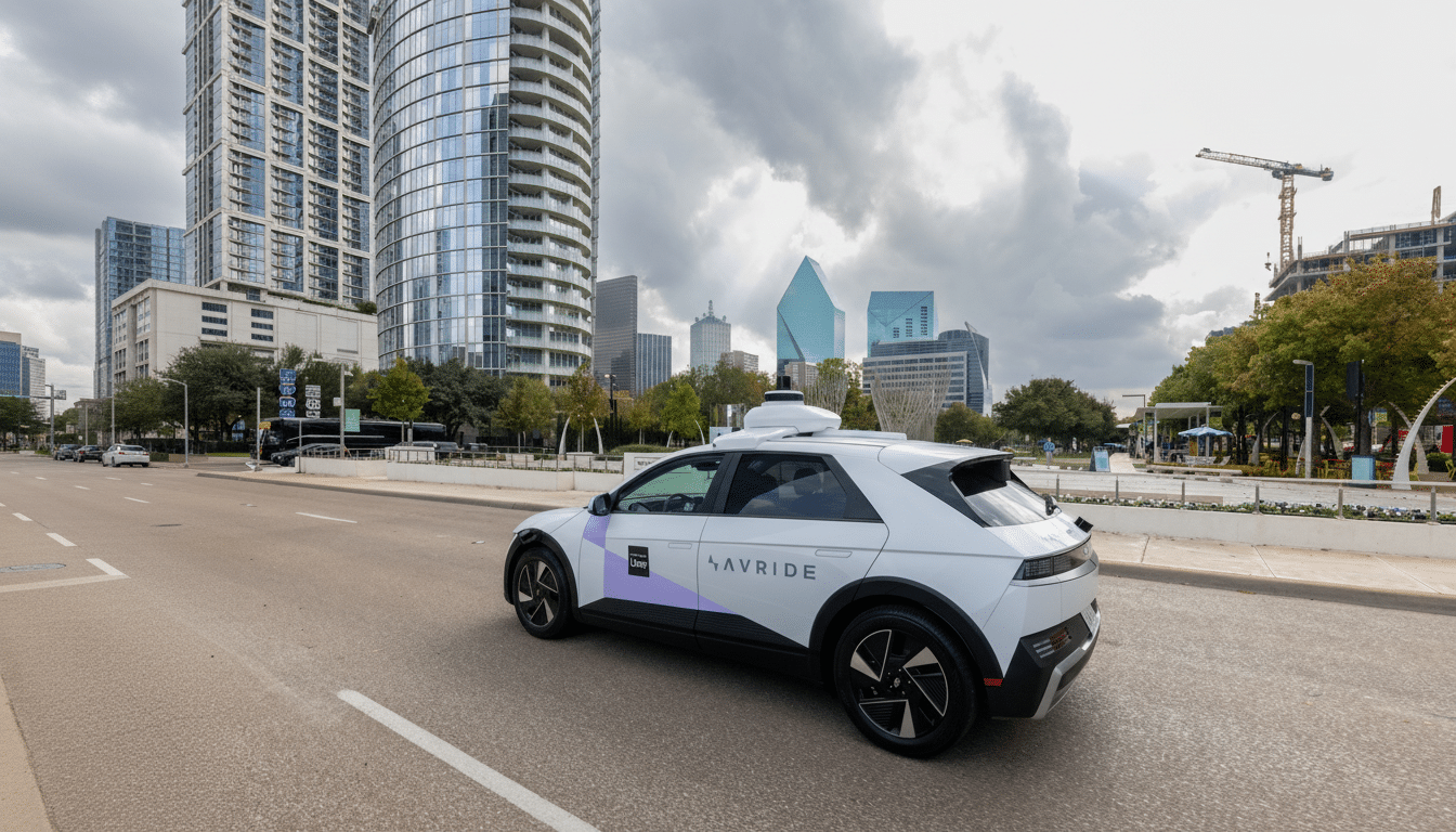 A white autonomous vehicle with Uber and AVRIDE logos on its side, driving on a city street with modern buildings and a cloudy sky in the background.