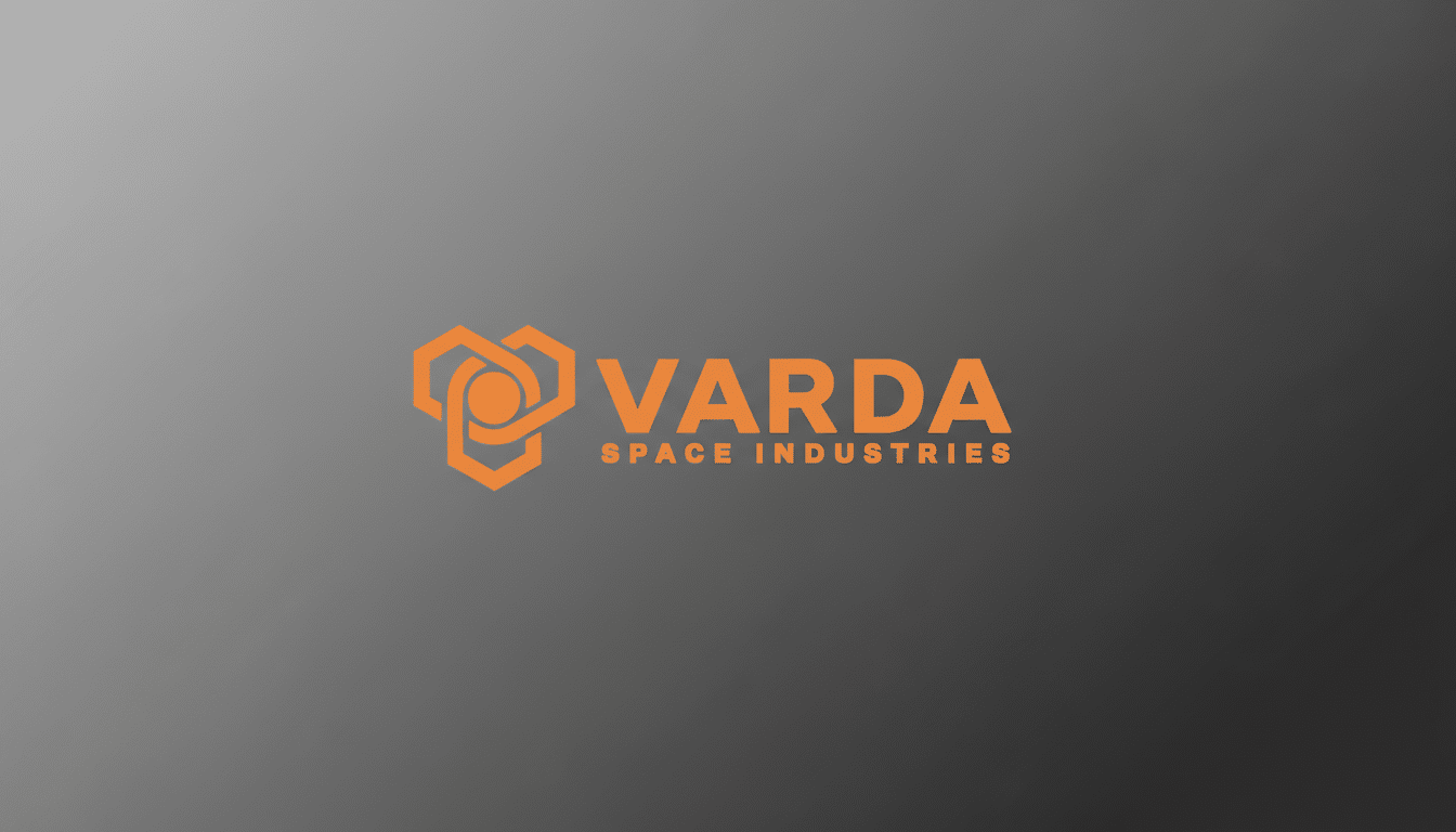 The Varda Space Industries logo, featuring an orange geometric design and text, presented on a professional gray gradient background with a 16:9 aspect ratio.