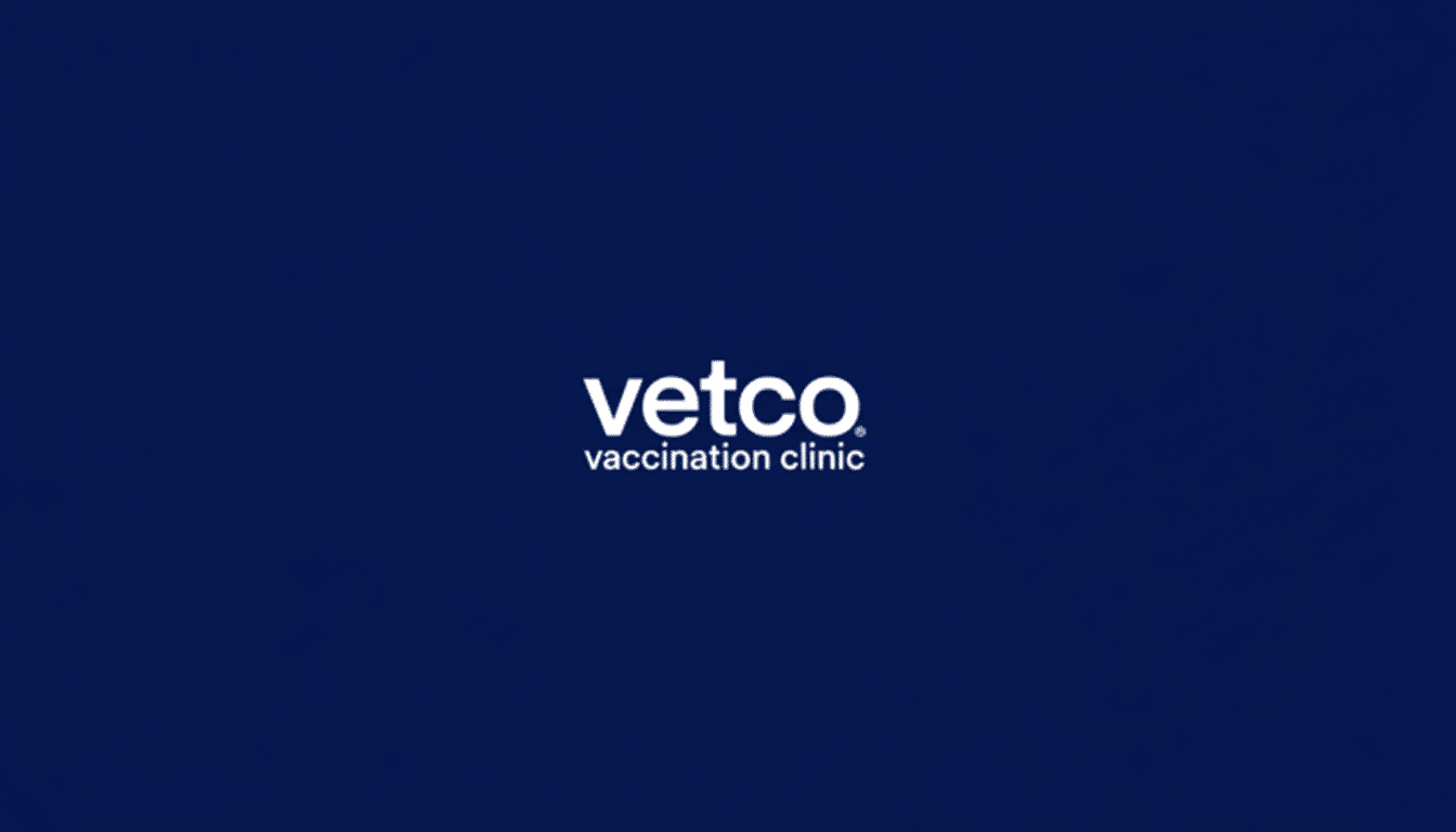 The Vetco Vaccination Clinic logo, featuring vetco in white sans-serif font with vaccination clinic below it in a smaller, similar font, centered on a dark blue background. The image has been resized to a 16:9 aspect ratio.
