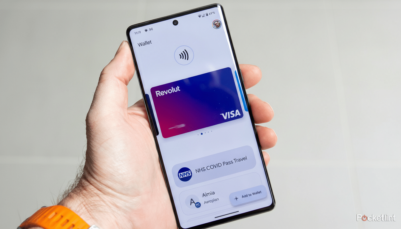 A hand holding a smartphone displaying the Revolut card and other passes in the Wallet app, resized to a 16:9 aspect ratio.