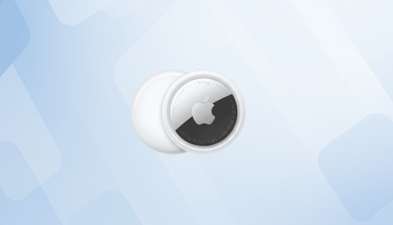 An Apple AirTag on a light blue background with subtle, rounded rectangular patterns.