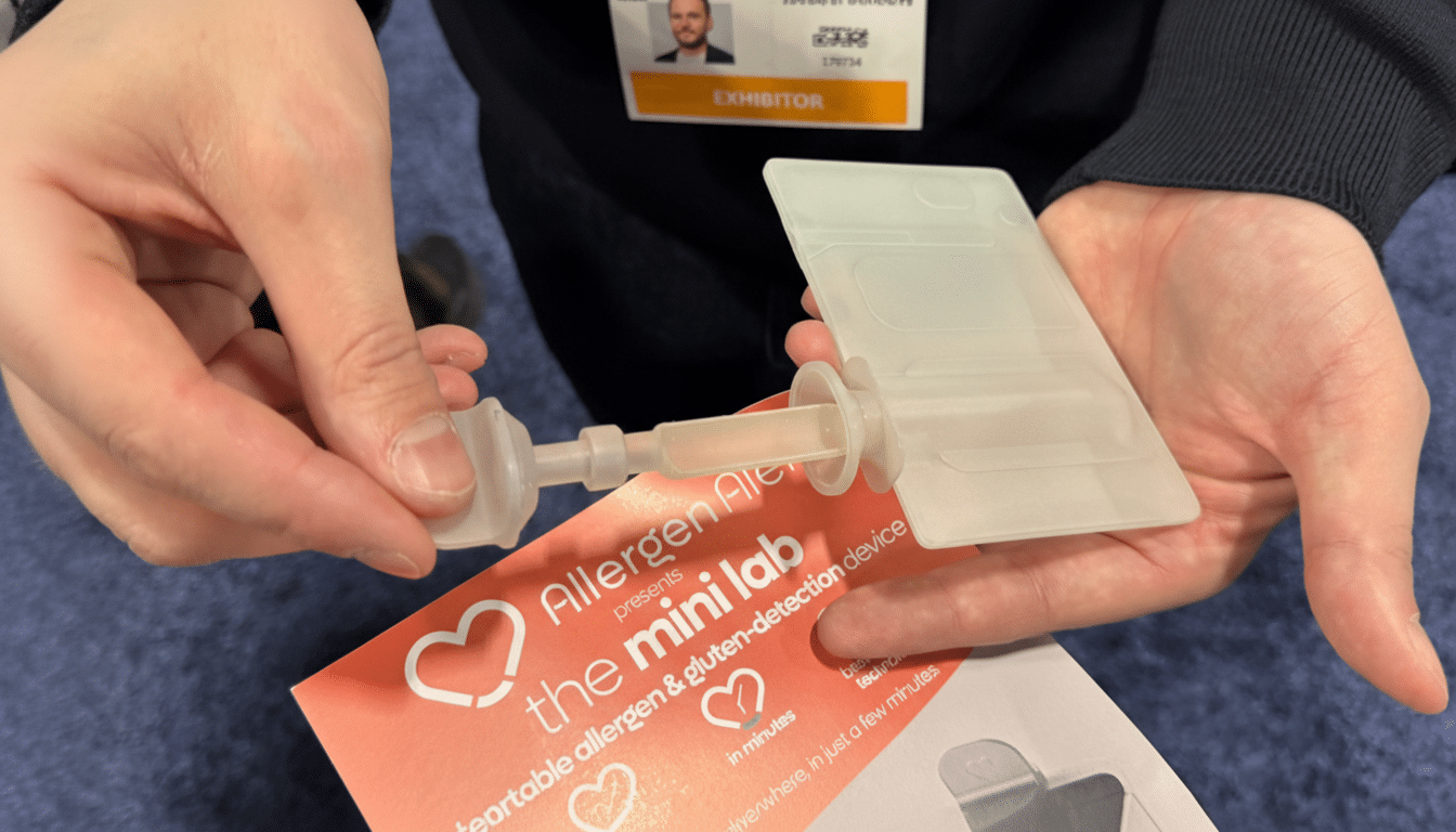 A persons hands holding a white, translucent allergen and gluten detection device over a red and white informational card.