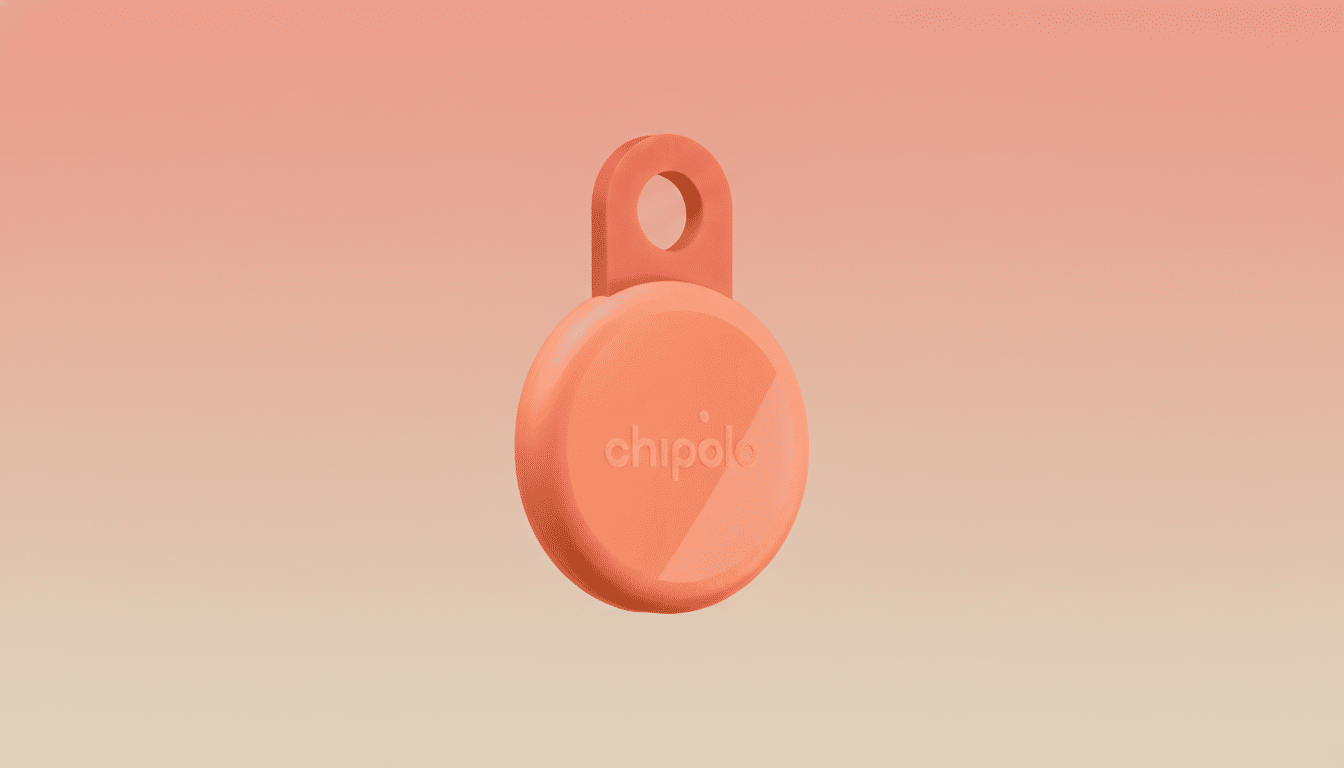 A coral-colored Chipolo tracker with a loop, centered on a soft, gradient background of light peach and coral.