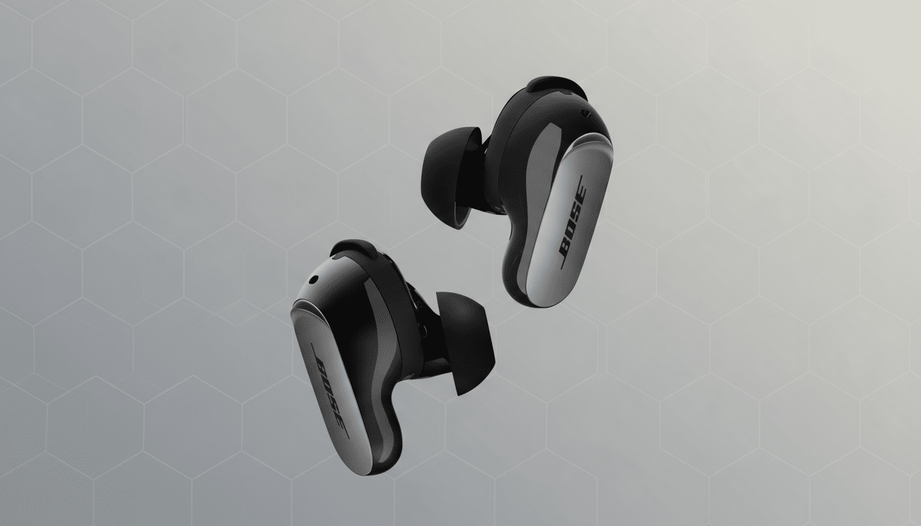 A pair of black Bose QuietComfort Earbuds II with silver accents, presented on a professional gray background with a subtle hexagonal pattern.