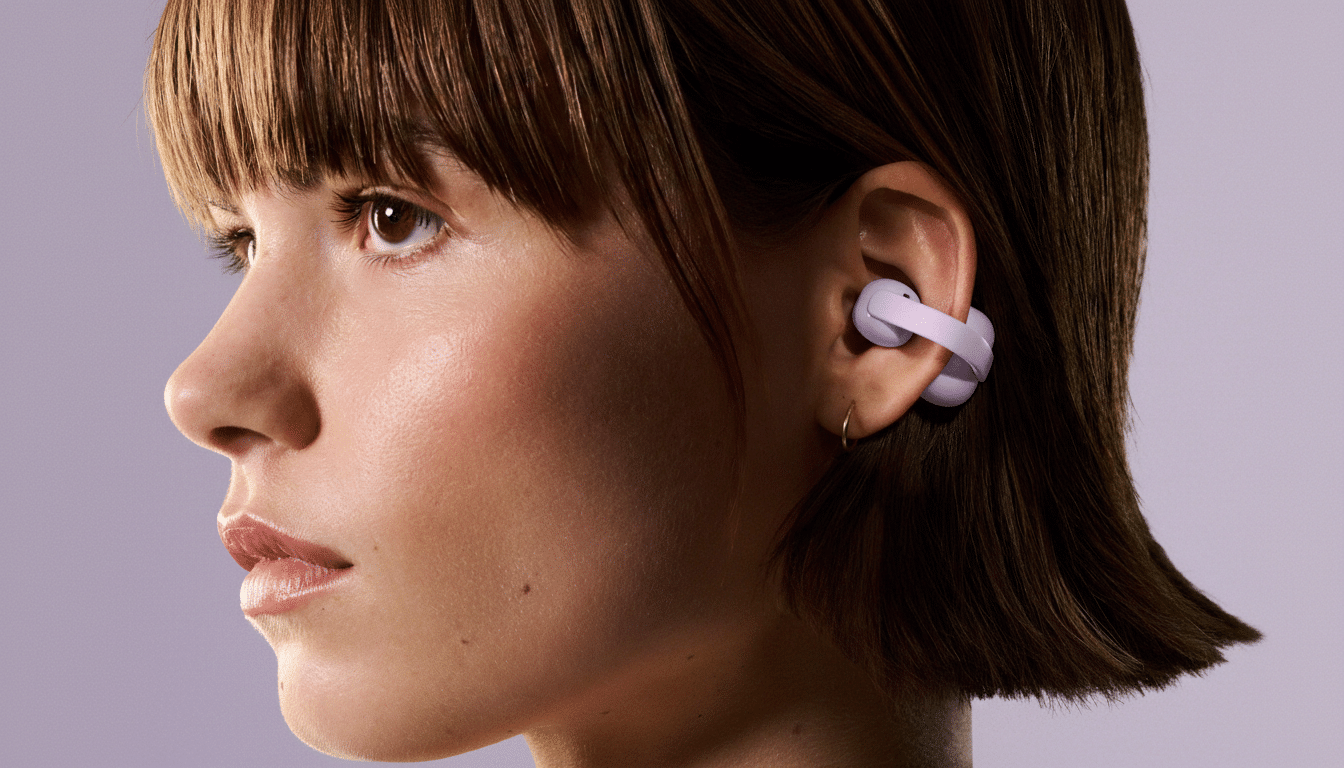 A close-up, professionally enhanced image of a woman with short brown hair, looking to the left, wearing a lavender earbud in her right ear. The background is a soft, solid lavender color.