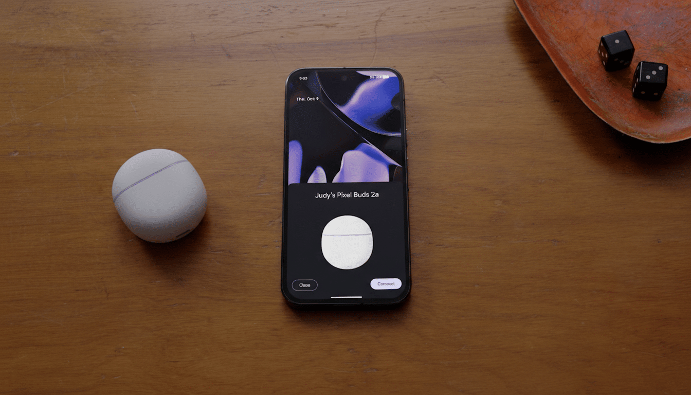A smartphone displaying a connection prompt for Judys Pixel Buds 2a next to a white Pixel Buds case on a wooden surface.