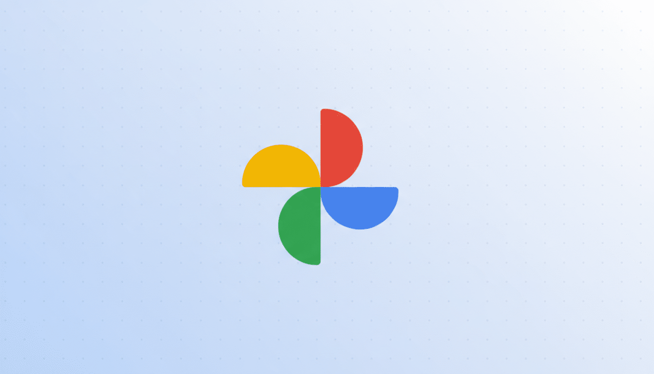 The Google Photos logo, consisting of four colorful, semicircular shapes (red, yellow, green, and blue) arranged in a pinwheel pattern, centered on a light blue background with a subtle grid pattern.