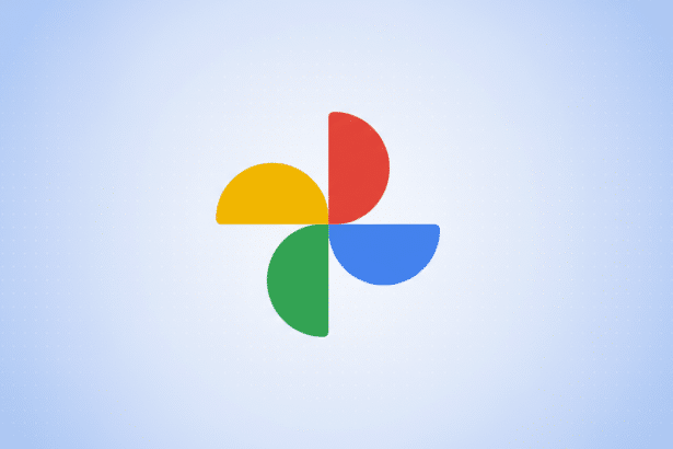 The Google Photos logo, consisting of four colorful, semicircular shapes (yellow, red, blue, and green) arranged in a pinwheel pattern, centered on a light blue background with a subtle dotted pattern.