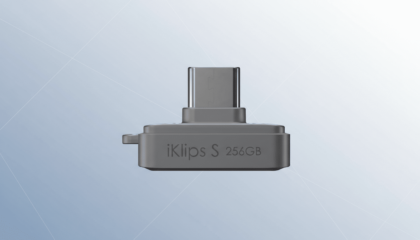 A gray iKlips S 256GB USB drive with a USB-C connector, presented on a professional flat design background with soft blue and gray gradients and subtle geometric patterns.