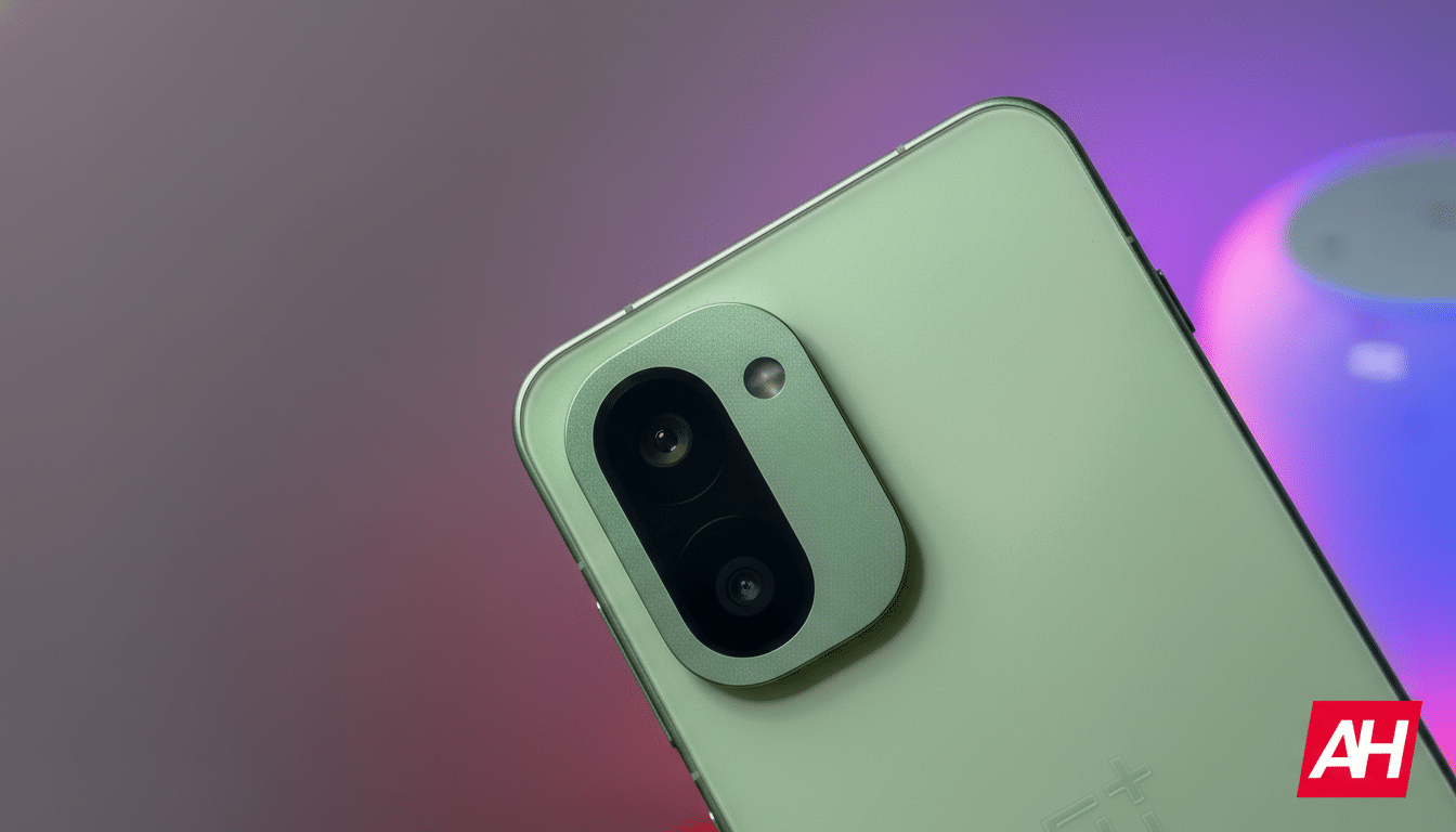 A close-up, professional shot of the back of a light green smartphone, showcasing its camera module with two lenses and a flash, set against a subtly blurred background with hints of purple and red lighting.