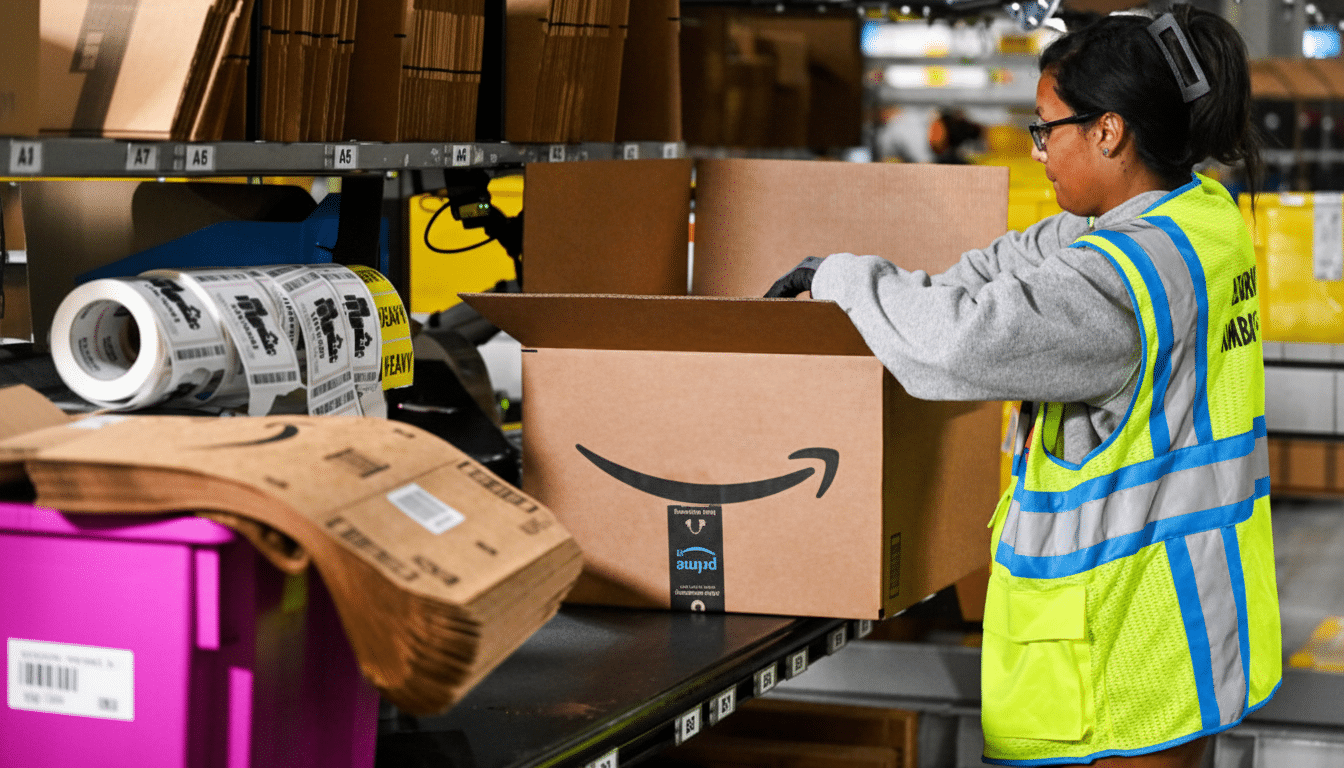 A person in a high-visibility vest packing an Amazon box in a warehouse.