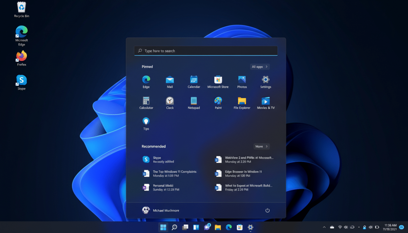 A screenshot of the Windows 11 desktop with the Start menu open, displaying pinned applications and recommended files.
