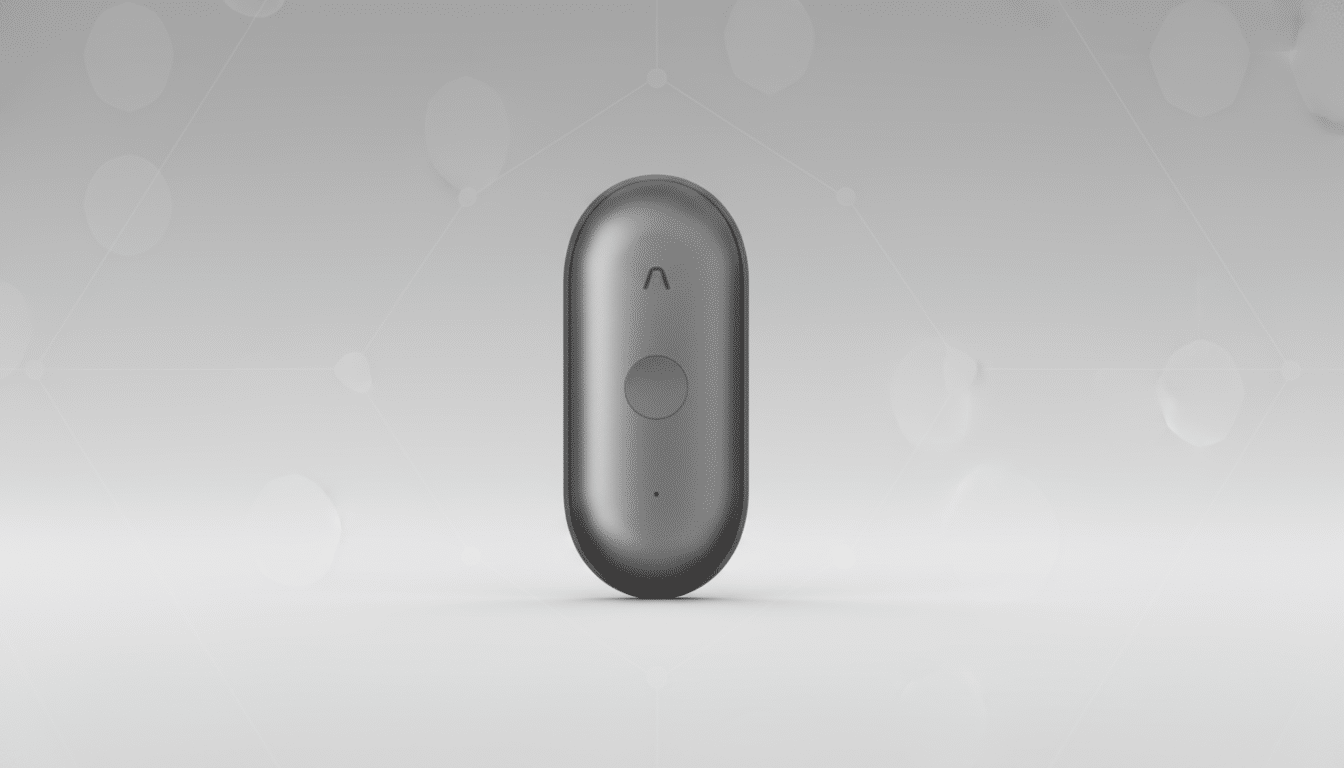 A sleek, dark gray, oval-shaped device with a circular button in the center and a small red indicator light at the top, presented on a professional light gray background with subtle geometric patterns.