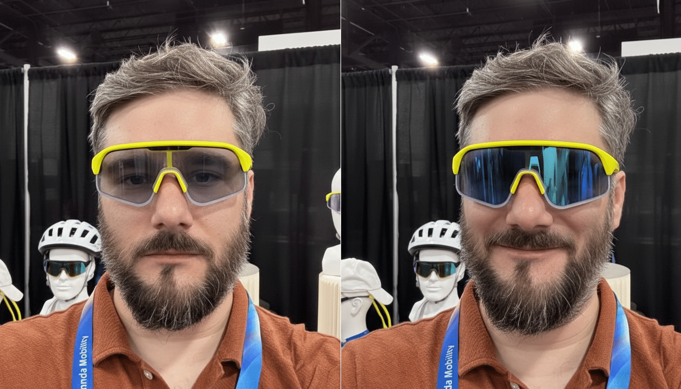 A man with a beard wearing two different pairs of yellow-framed sunglasses, one with clear lenses and one with blue reflective lenses, against a dark background with mannequins.