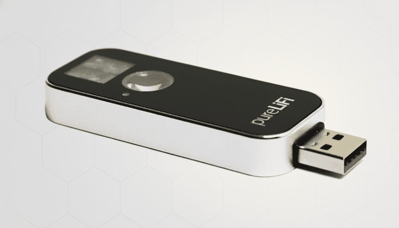 A PureLiFi USB dongle with a black top and silver base, featuring a small screen and a USB-A connector, set against a professional light gray background with a subtle hexagonal pattern.