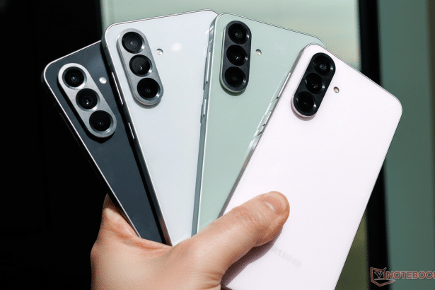 A hand holding four Samsung Galaxy S23 FE phones in black, white, mint, and purple, presented in a 16:9 aspect ratio.