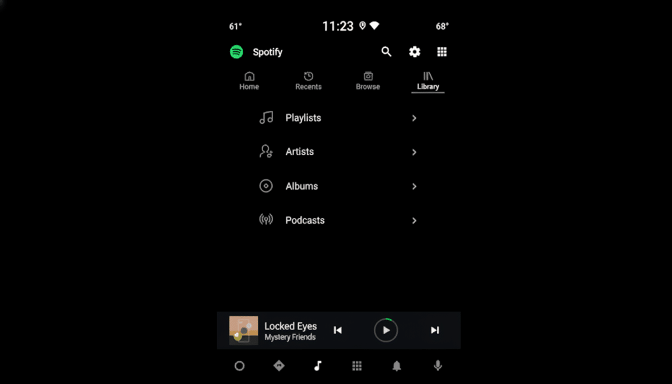 A screenshot of the Spotify app interface in dark mode, showing the Library section with options for Playlists, Artists, Albums, and Podcasts. A song titled Locked Eyes by Mystery Friends is playing at the bottom.