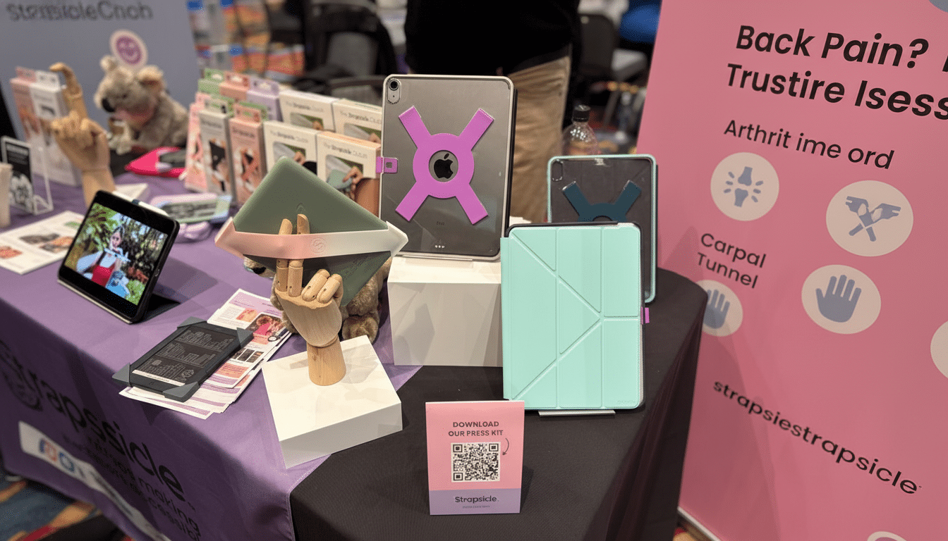 A display of tablet accessories, including cases and stands, with a QR code for a press kit.