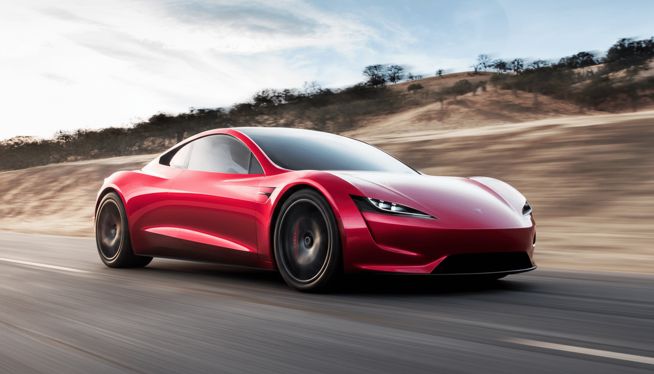 A red Tesla Roadster driving on a winding road with a blurred background of hills and sky.